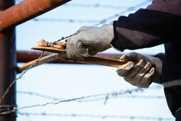 Barbed wire fence repair